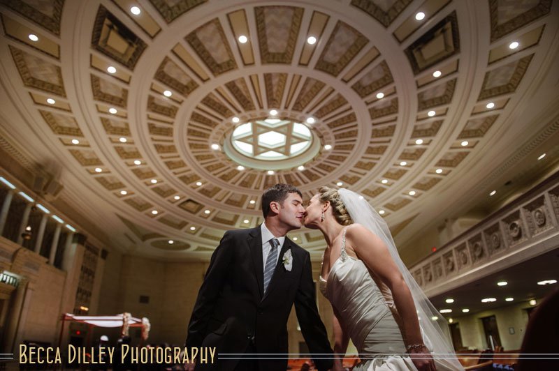 Bride and groom under Star of David ceiling at Temple Israel Minneapolis