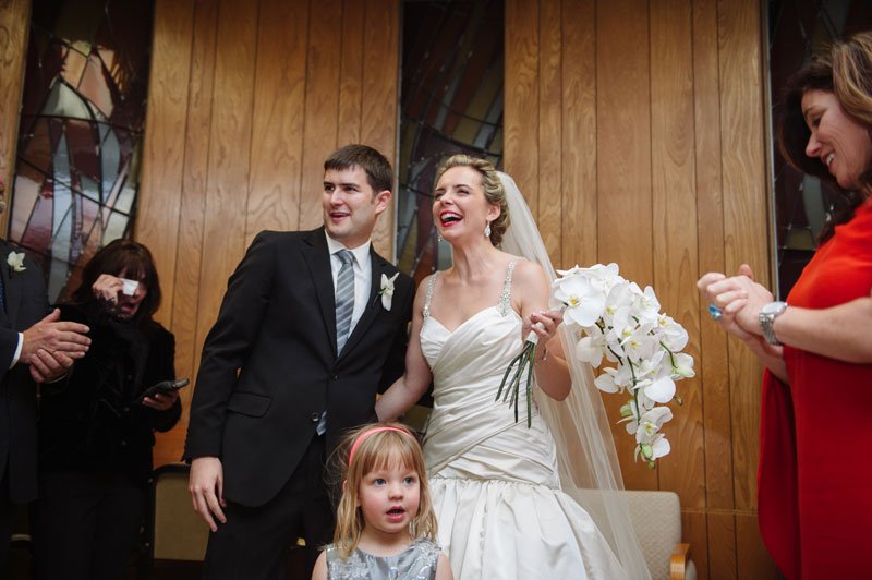 bride and groom laugh after signing the Ketubah at Temple Israel Minneapolis