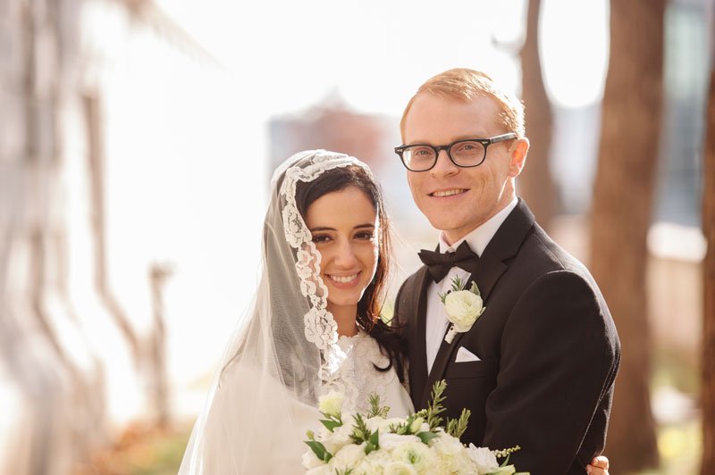 st paul mn wedding at jj hill library bride and groom outside with vintage veil