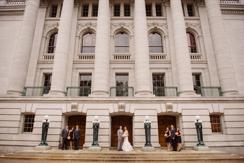 wedding party with architecture of madison capitol building