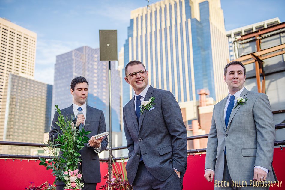 groom waits for bride on rooftop of solera restaurant downtown minneapolis wedding