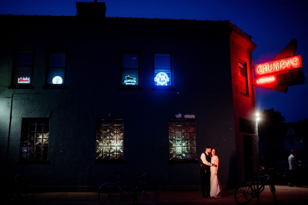 couple outside of grumpys dive bar wedding