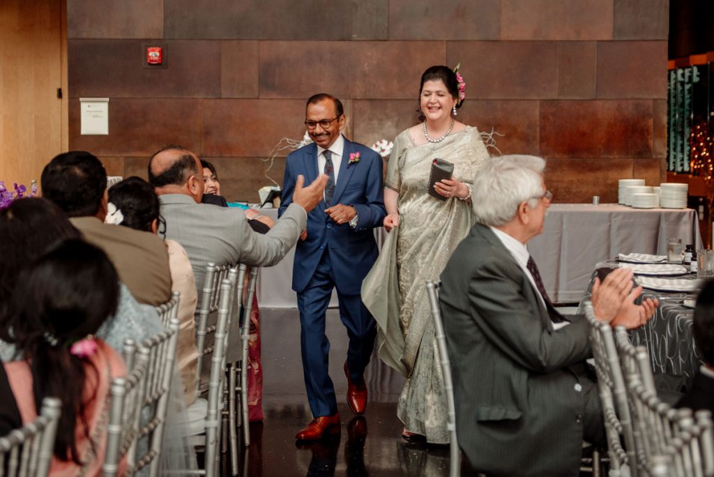 grooms parents enter wedding at McNamara
