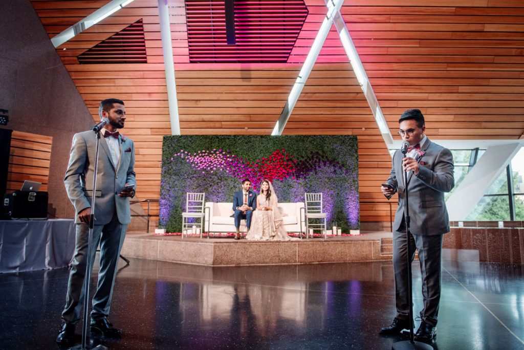 MCs for the evening give toasts mulsim pakistani wedding at McNamara Center in Minneapolis