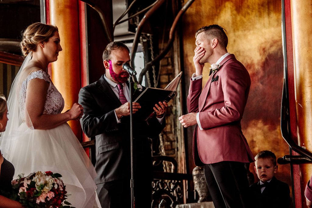groom excited during wedding vows at loring restaurant wedding minneapolis