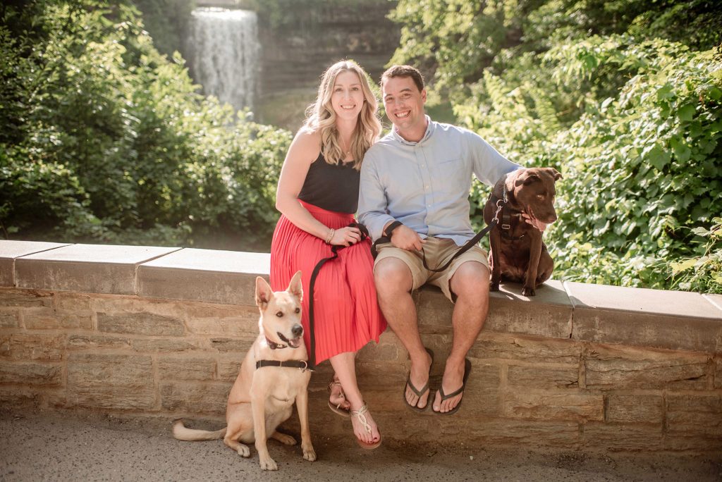 Minnehaha falls family portrait with dogs by waterfall - Portrait Location Guide Twin Cities