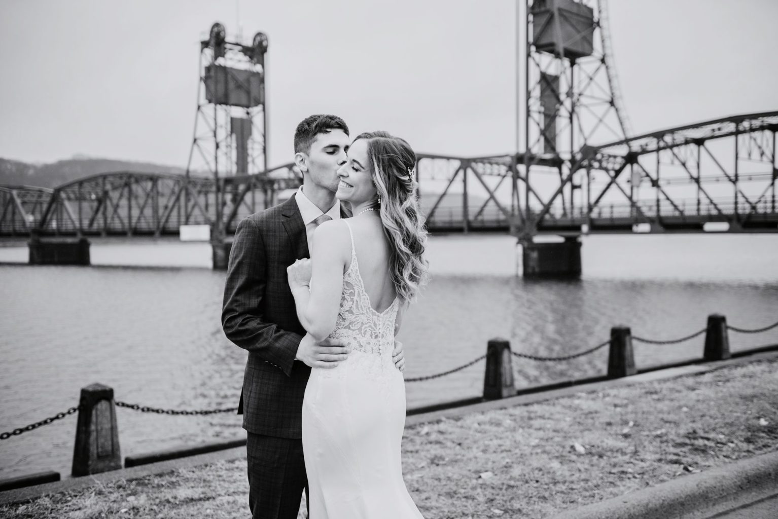 black and white photo of couple in front of stillwater liftbridge in mn before their loft wedding