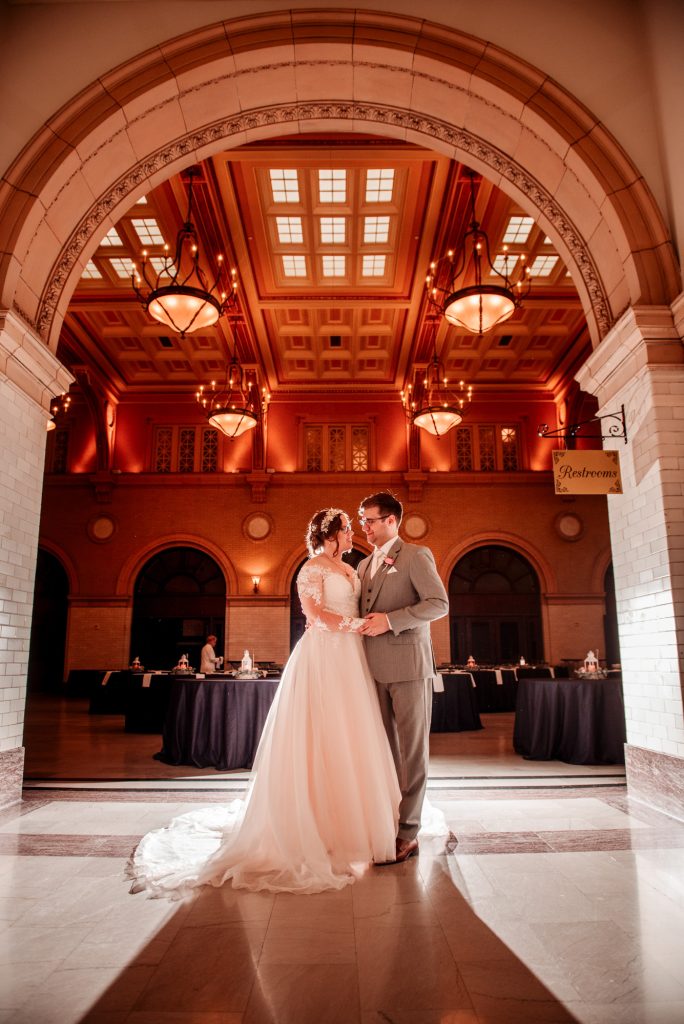 Couple in great hall of Renaissance Minneapolis Depot wedding