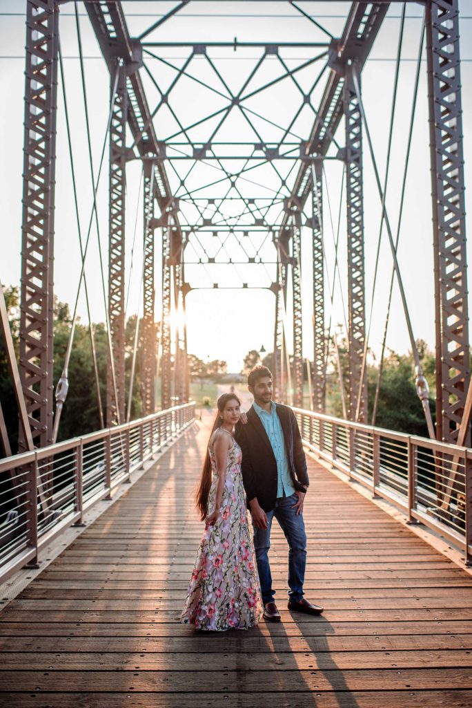 couple on iron bridge for minneapolis engagement session